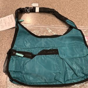 NWT ThirtyOne Exporista Crossbody with adjustable strap, can snap onto stroller